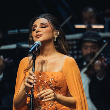Angham Moved to Tears During Doha Concert, Dazzles in Orange
